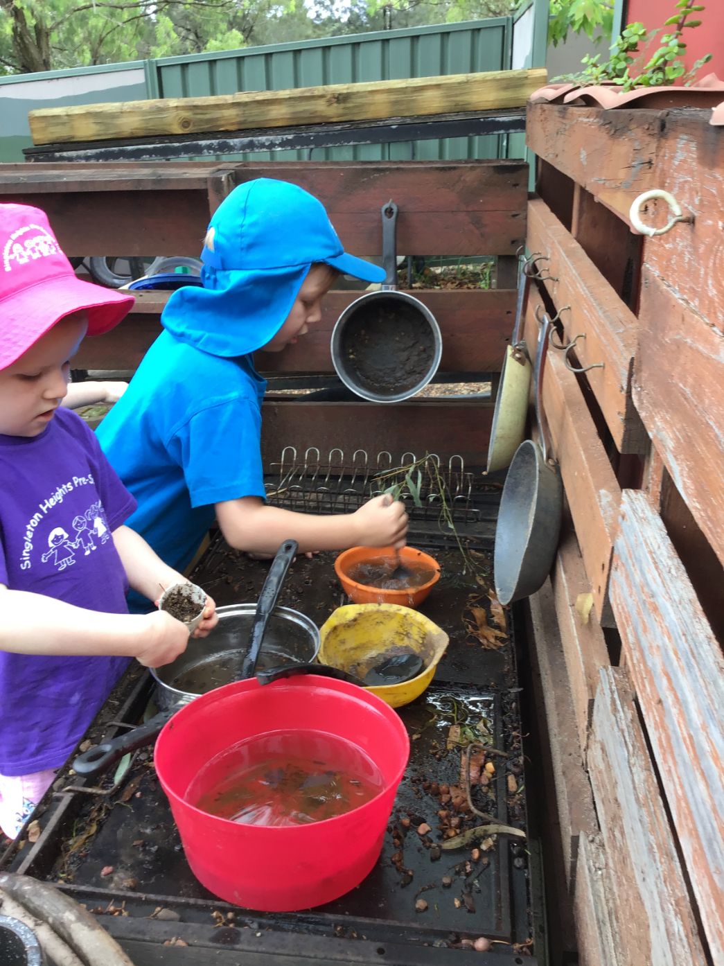 As part of childhood development, our curriculum provides opportunities for children to choose activities such as pretend cooking, that allow them to practice and develop skills spontaneously.