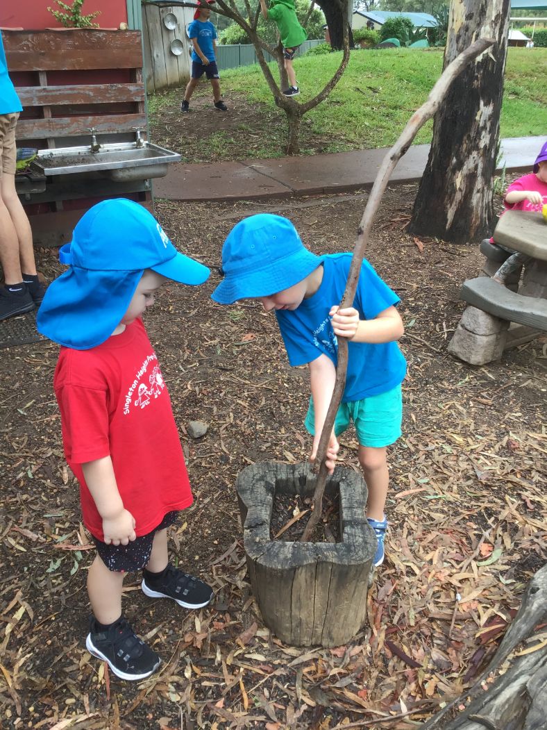 Children playing outdoors as part of the learning environment to influence thinking, mood, behaviour, learning and emotions.